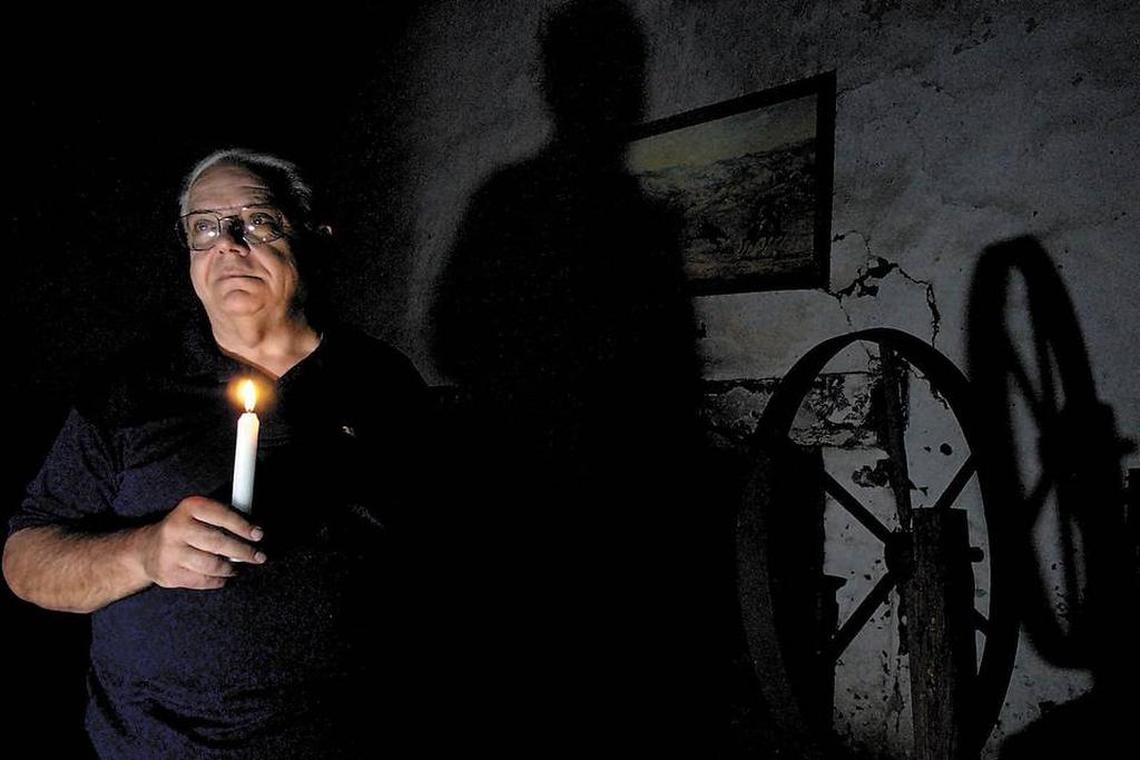 The late Wally Ohles in 2003 stands inside the room at Misssion San Miguel where it’s thought the murders occurred.