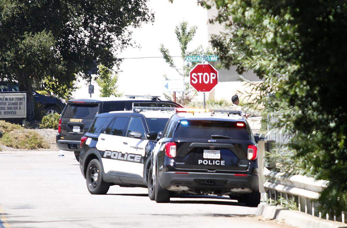 Police and sheriff’s units search Atascadero Creek after a man with a long gun was spotted in the area near the high school on Wednesday, Aug. 31, 2022. Schools in the area were placed on lockdown during the search.