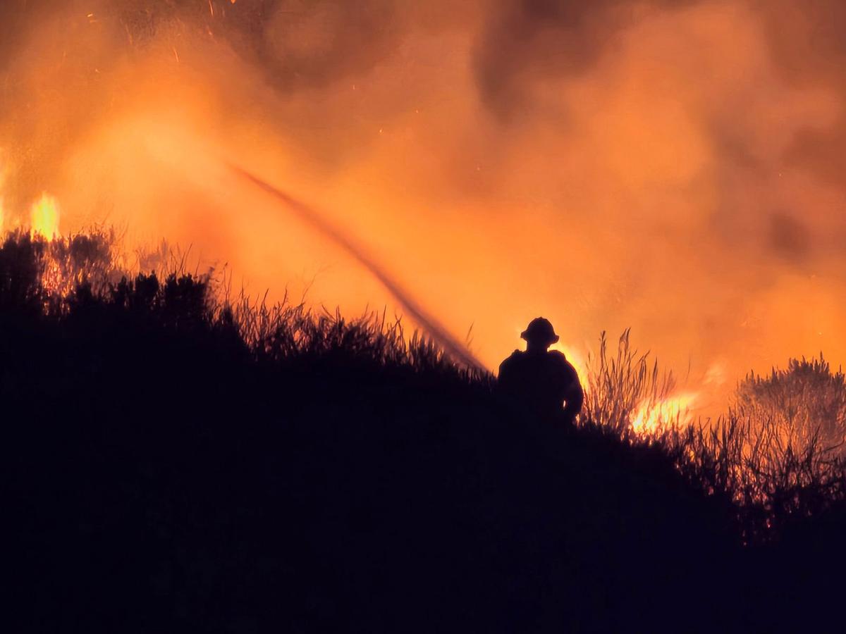 An early morning fire shut down the northbound Highway 101 lanes through Pismo Beach on Oct. 20, 2024, as firefighters tried to get the blaze under control.
