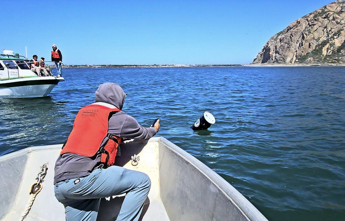 Cal Poly students went out on the water in Morro Bay on May 23, 2025, to test a prototype for a device that uses wave energy to charge batteries. Here, a student tests to see if the Expeditionary Ocean Power Generator was generating energy.