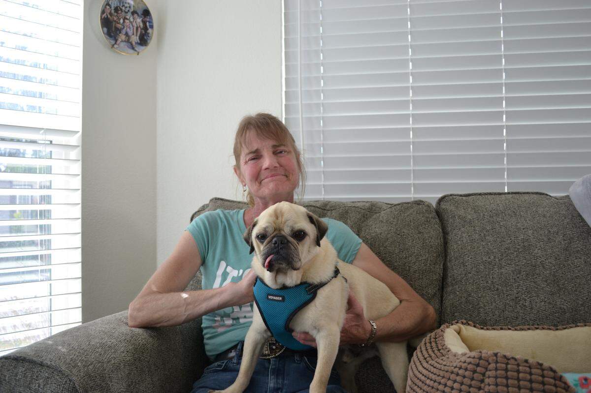 Christy Nair and her pug, Duke, have lived at Silver City West mobile home park for about 11 years. Nair’s first home was protected by rent control, but when she moved to a new unit, she lost her rent control protections.