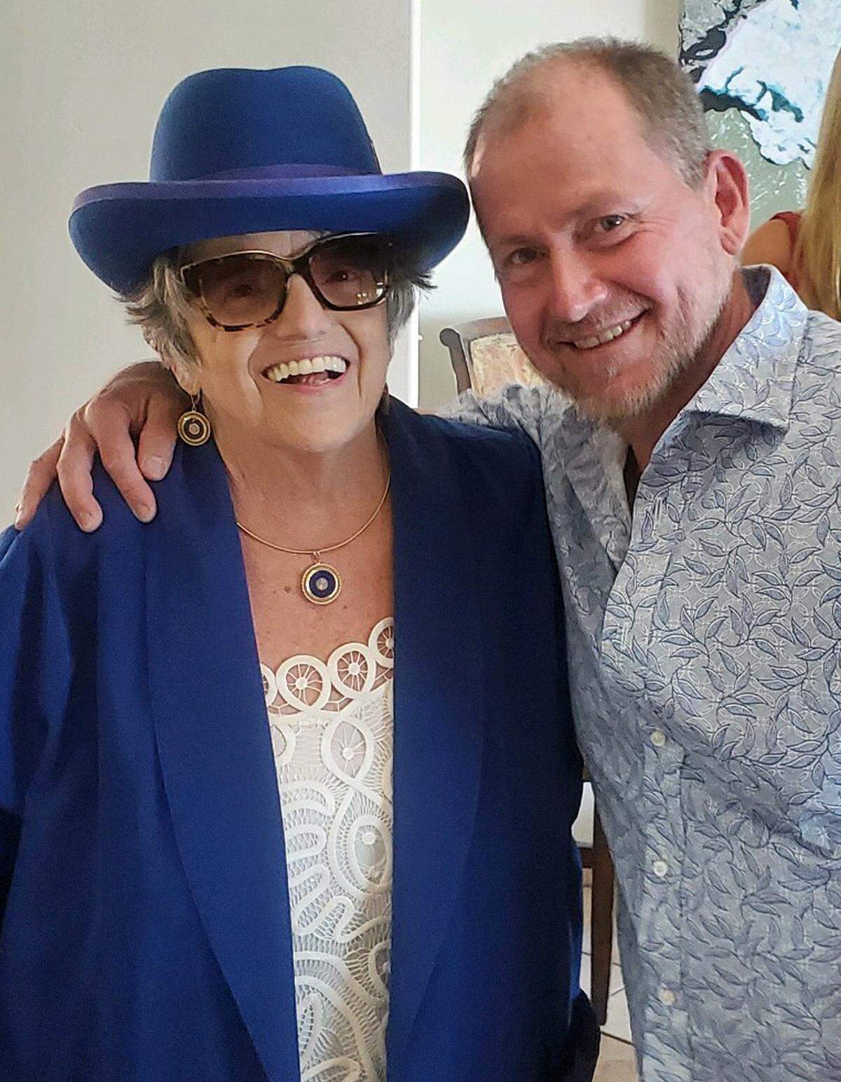 Columnist and mother of the groom Kathe Tanner and co-officiant Rich Schlosser, a longtime friend, share a hug before the ceremony in which Sean Tanner and his bride Jenny Hayes get married.