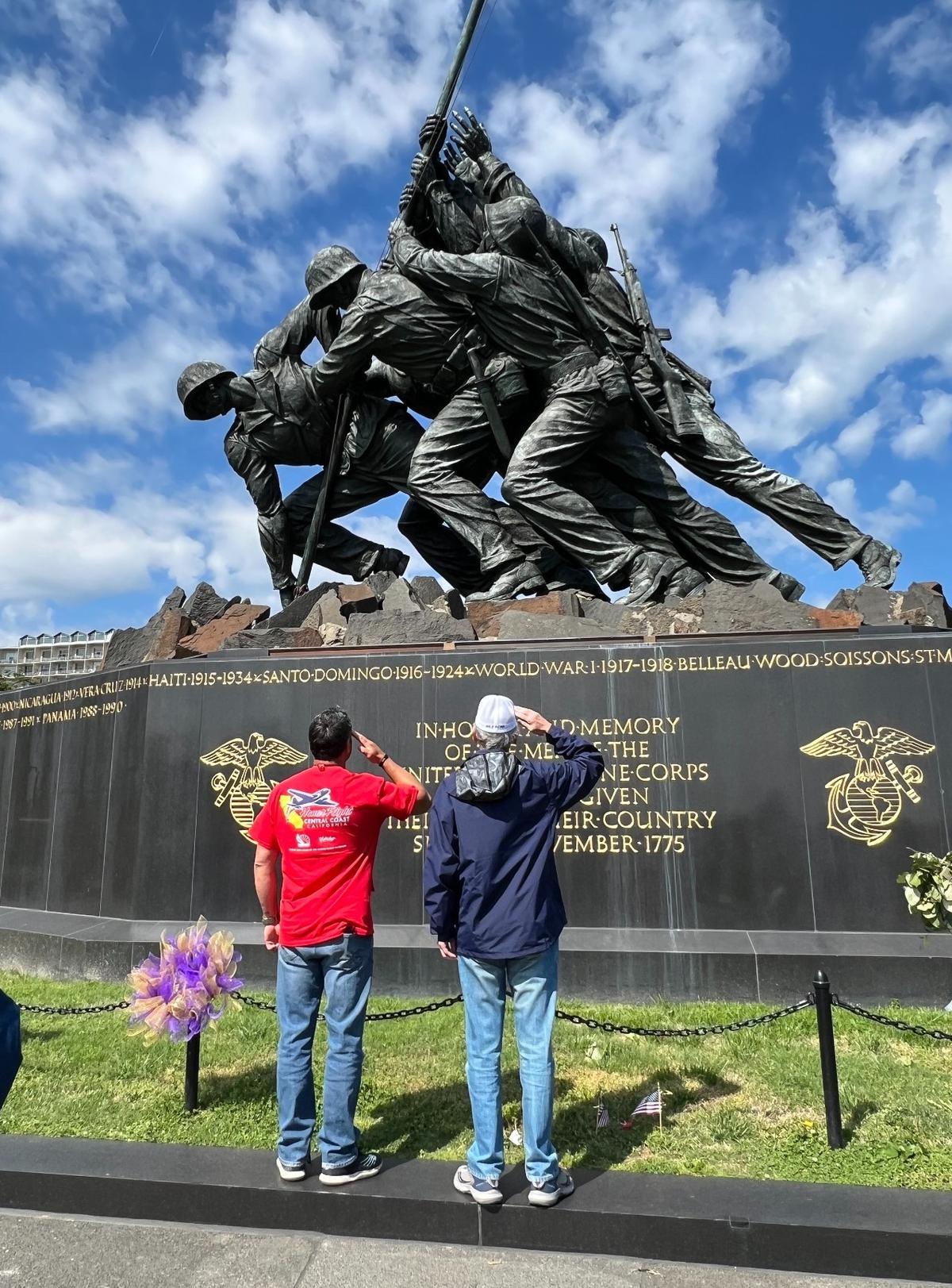 Honor Flight participants from the Central Coast salute the Iwo Jima statue and the Marine Corps War Memorial in Washington, D.C., on Tuesday, April 25, 2023.
