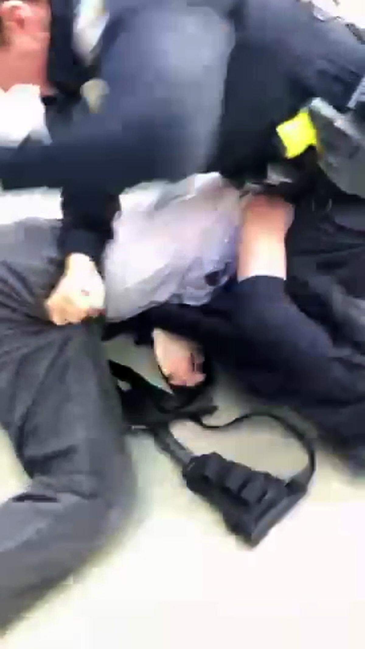 A San Luis Obispo police officer arrests a protester during an pro-Palestine demonstration at Cal Poly on Jan. 23, 2024.