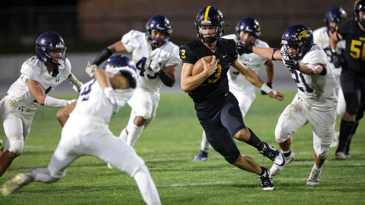 Jace Gomes was under pressure at quarterback from a swarming Eagle defense. Arroyo Grande beat San Luis Obispo 23-0 Sept. 6, 2024.