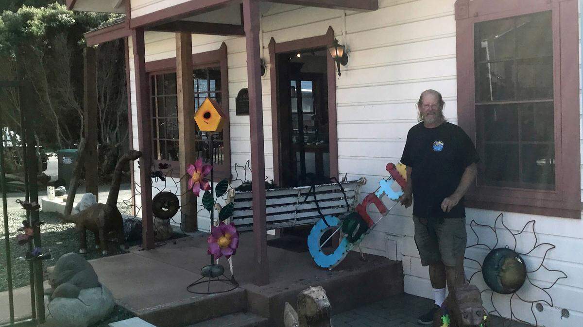 Owner Bill Bookout poses for a picture in front of Cambria Surf Shop, 4015 West St. in Cambria. He also plans to open a surf shop on Cambria’s Main Street.