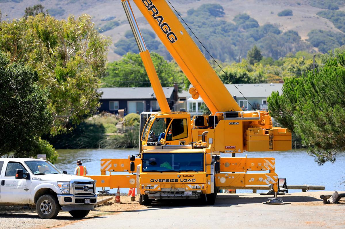 Laguna Lake Park in San Luis Obispo was temporarily closed while a large crane set up dredging equipment on the east side of the lake.