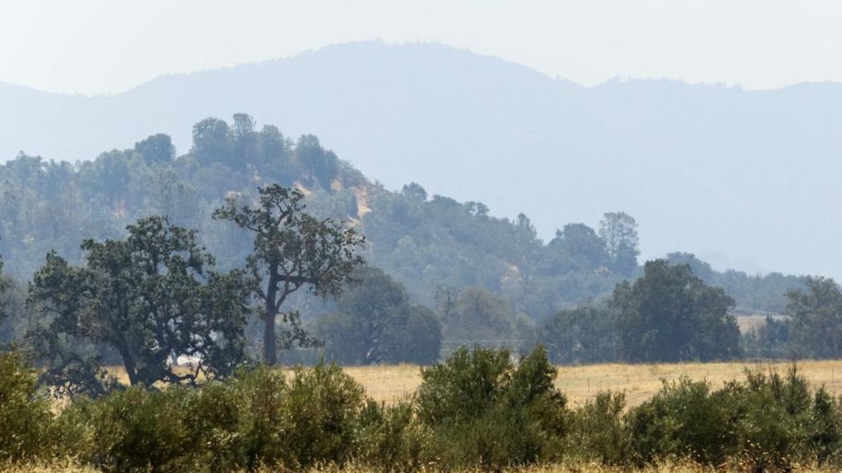 A smoky haze fills the air and obscures the hills east of Santa Margarita on Tuesday. The smoke is from the Soberanes Fire in Monterey County, which has burned more than 19,000 acres.