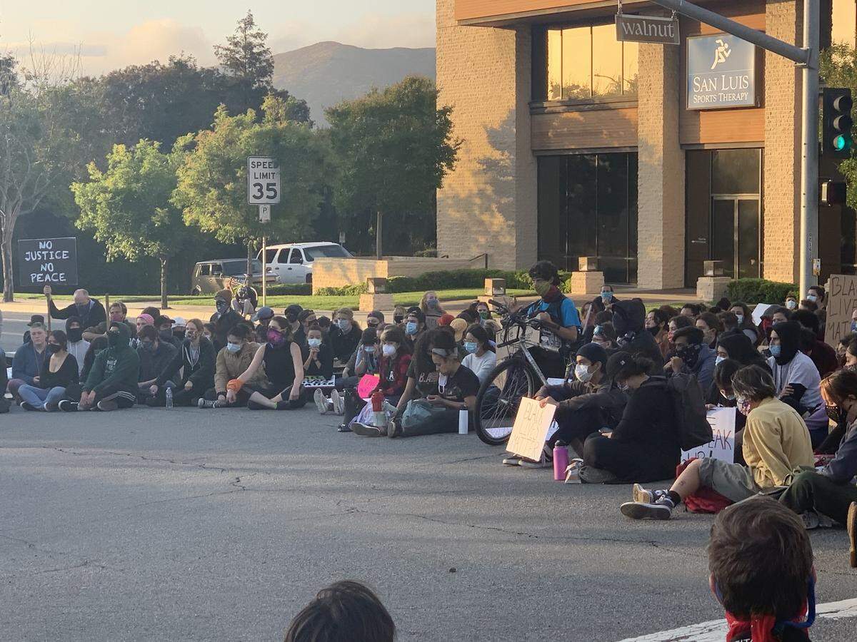 Protesters gather near the SLO police station at a recent protest.