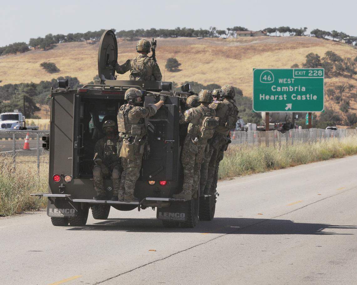 San Luis Obispo County law enforcement officers travel in an armored Bearcat vehicle near Volpi Ysabel Road and Ramada Drive, an industrial area on the south end of Paso Robles. Police killed a suspect accused of ambushing the Paso Robles Police Department, killing a homeless man and shooting a county sheriff’s deputy.
