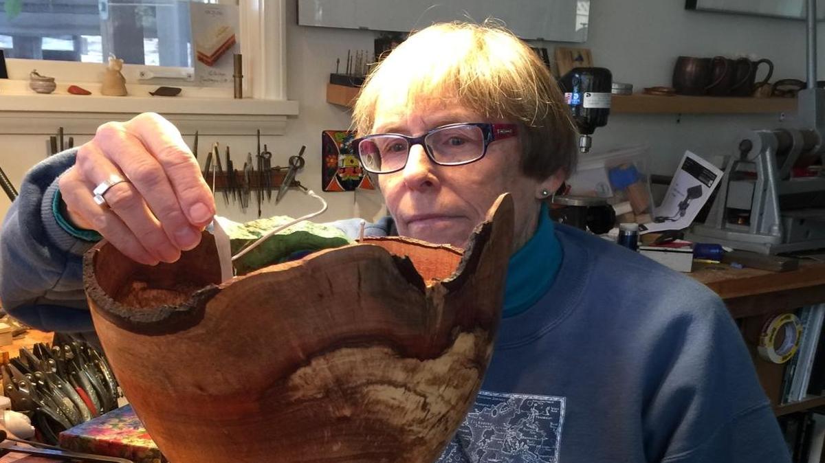 Local silversmith Crissa Hewitt affixes silver handles to local woodcrafter Barry Lundren’s hand-hewn bowl. Both artists will be featured at Celebrating the Visual Arts in San Luis Obispo.