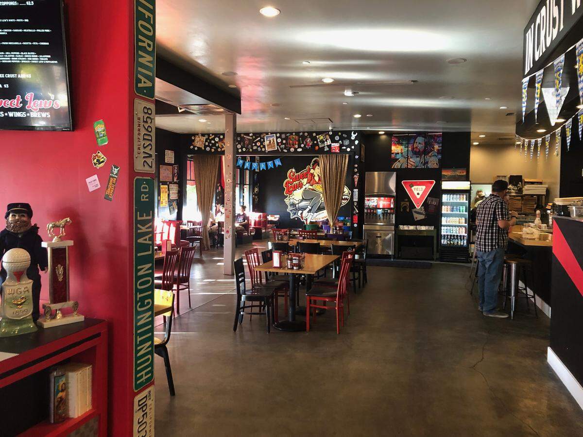 The entryway and dining room at Sweet Lew’s pizza restaurant in downtown Paso Robles. Owner Tim Lewis said he wants the eatery to have a relaxed, 1980s vibe.