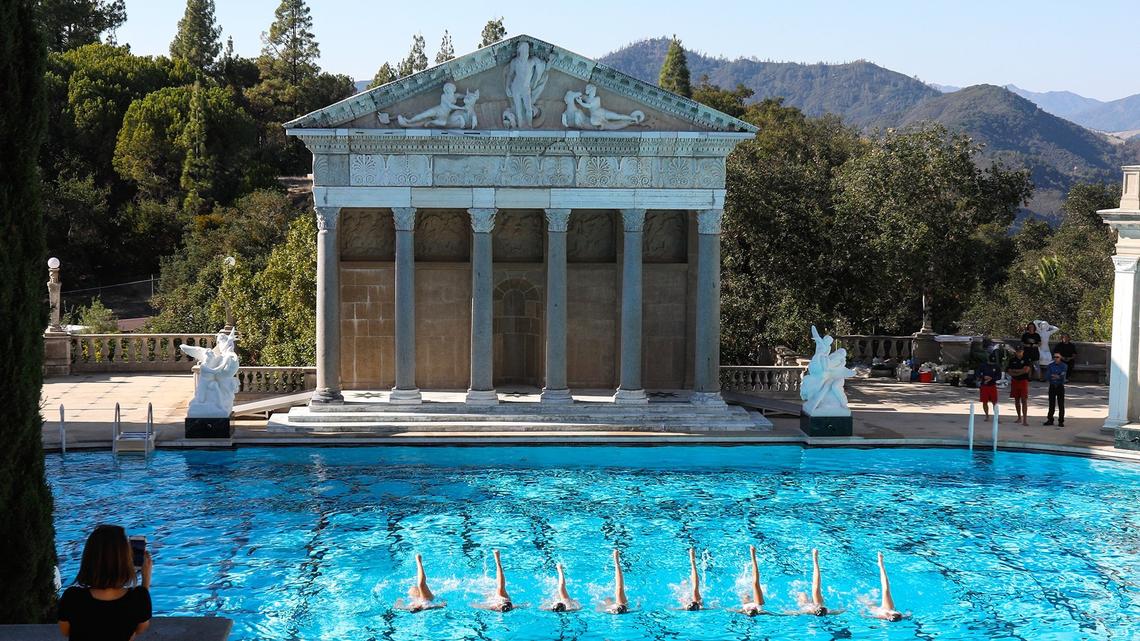 The Aquabatix synchronized swimmers practice their routine at Hearst Castle in San Simeon before Sunday’s gathering to celebrate the restoration and reopening of the Neptune Pool.