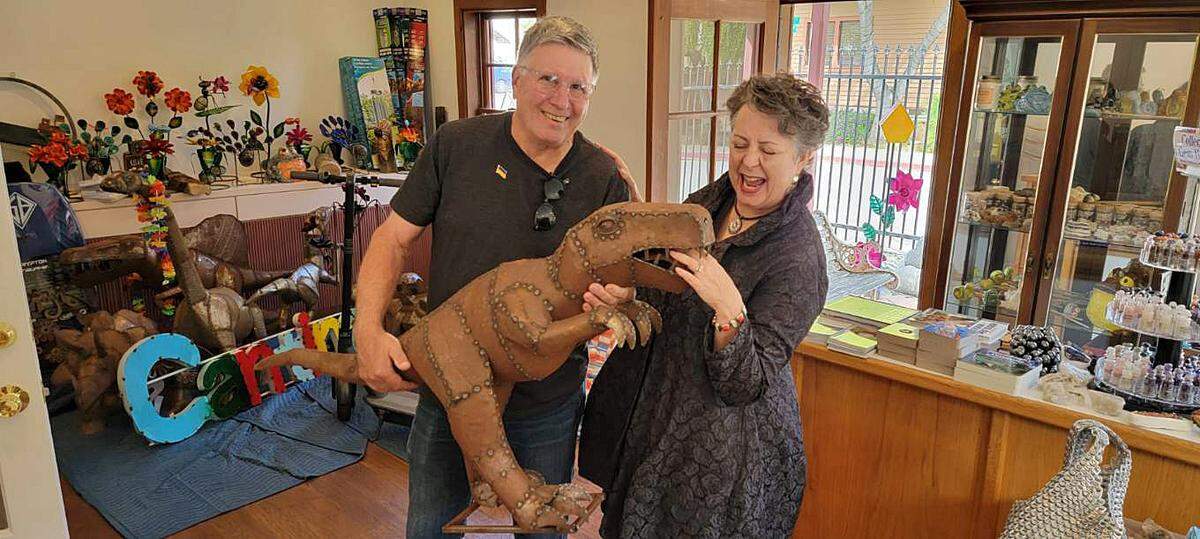 George and Michelle Paganini of San Jose bought this metal dinosaur sculpture at Cambria Surf Shop on Oct. 11, 2022.