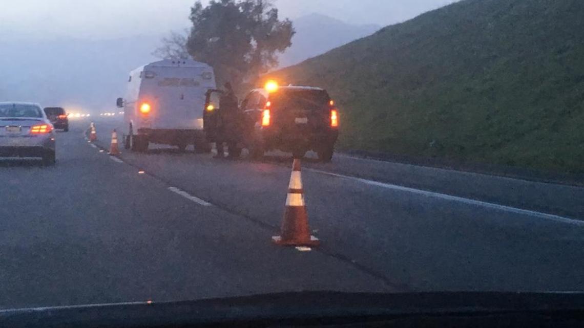 Traffic was reduced to one lane on Highway 101 in south Atascadero on Tuesday morning as Sheriff’s investigators continued work at the scene of an officer-involved shooting.