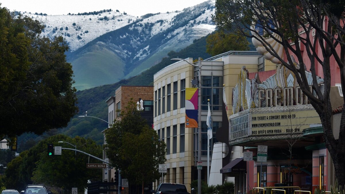 Snow can be seen on the mountains from downtown San Luis Obispo on Feb. 25, 2023.