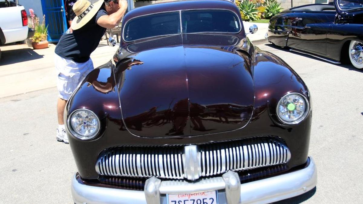 Fred Gutierrez of Grover Beach checks out a custom Mercury.