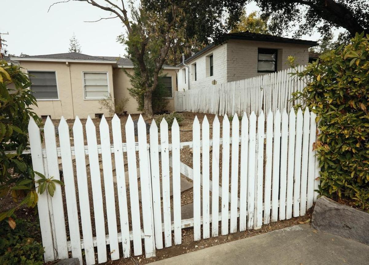 The 1930s residence at 614 Monterey St., right, is a rarity in San Luis Obispo because it is the only adobe of its time period within the Downtown Historic District. The home is available for free to anyone who wants to move it. A separate home at 610 Monterey St., left, is planned for demolition as part of the parking garage planned at Palm and Nipomo streets.