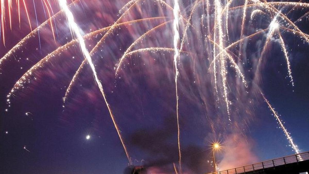 Danita Ross of Grover Beach watches the fireworks at the Pismo Beach Pier in 2017.