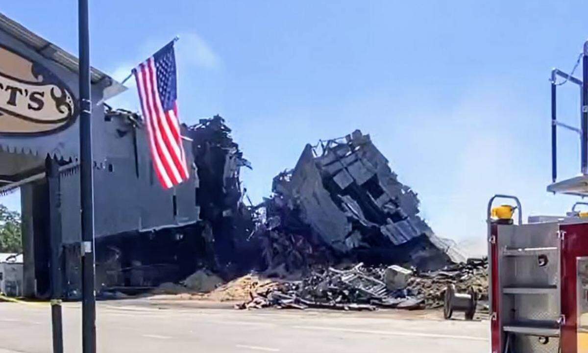 A demolition team brought down the southern portion of the burned-out Templeton Feed & Grain building on Monday, July, 7, 2025, after a fire gutted the historic granary on the Fourth of July.