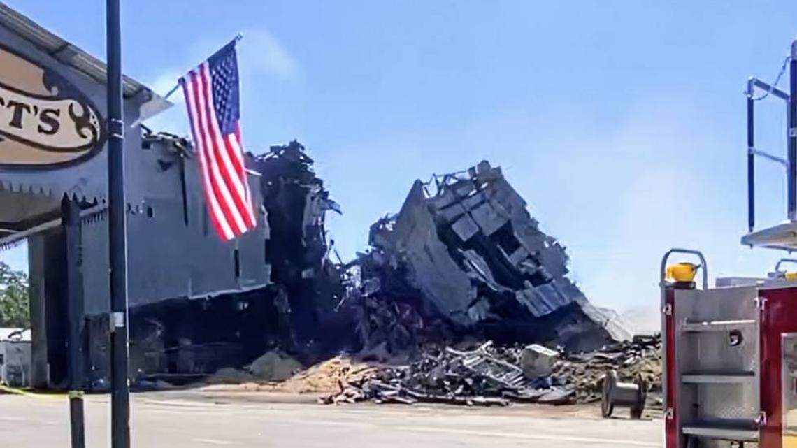 Half of burned-out Templeton Feed & Grain building collapses