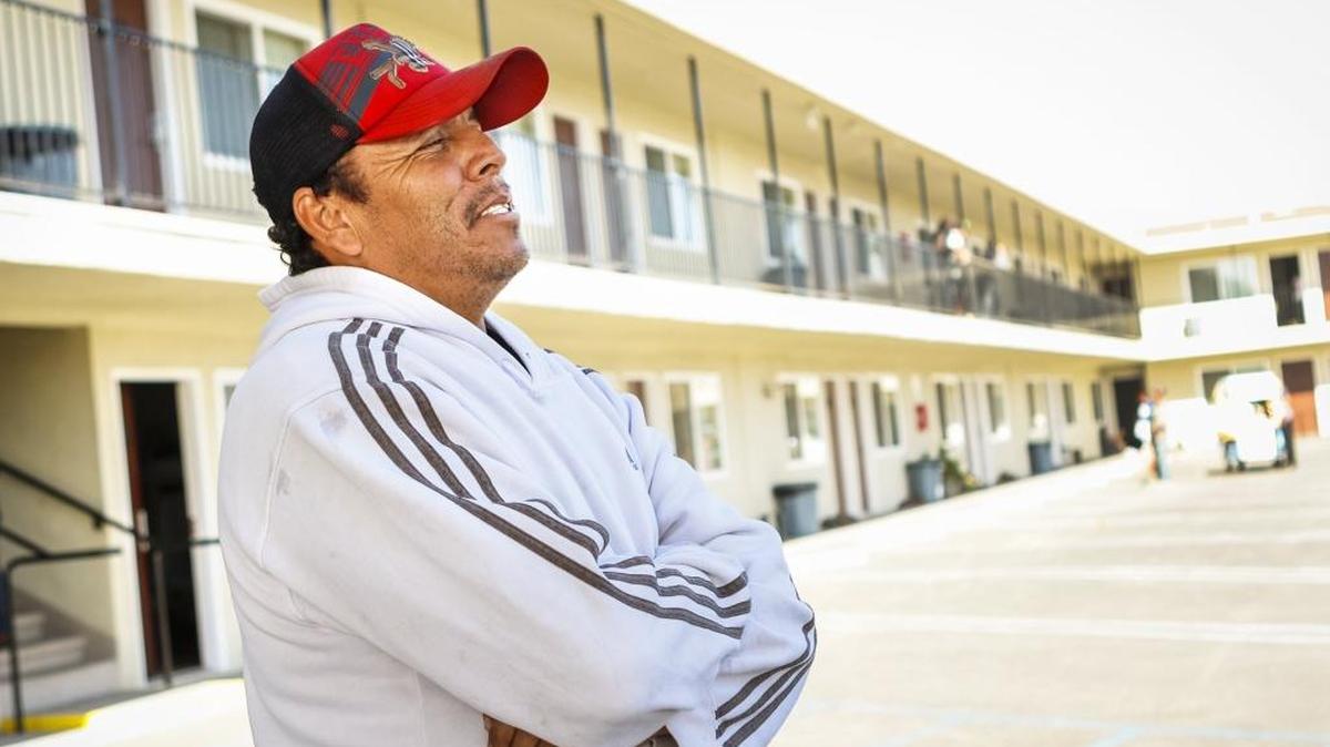 Jorge Avila earns $12 an hour picking crops as a guest worker in the federal H-2A program. From Sinaloa, Mexico, until November, he’s living in a room at at an old Budget Inn in Santa Maria that has been converted into housing.