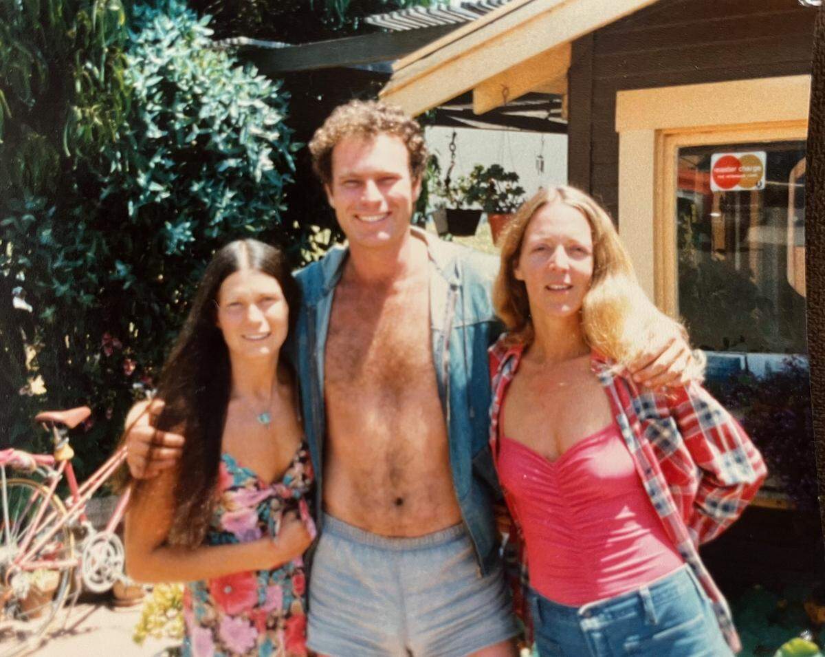 Linna Thomas (right) with Joe Cartwright and bookstore employee Sherrie Hereford during the early years of Coalesce.
