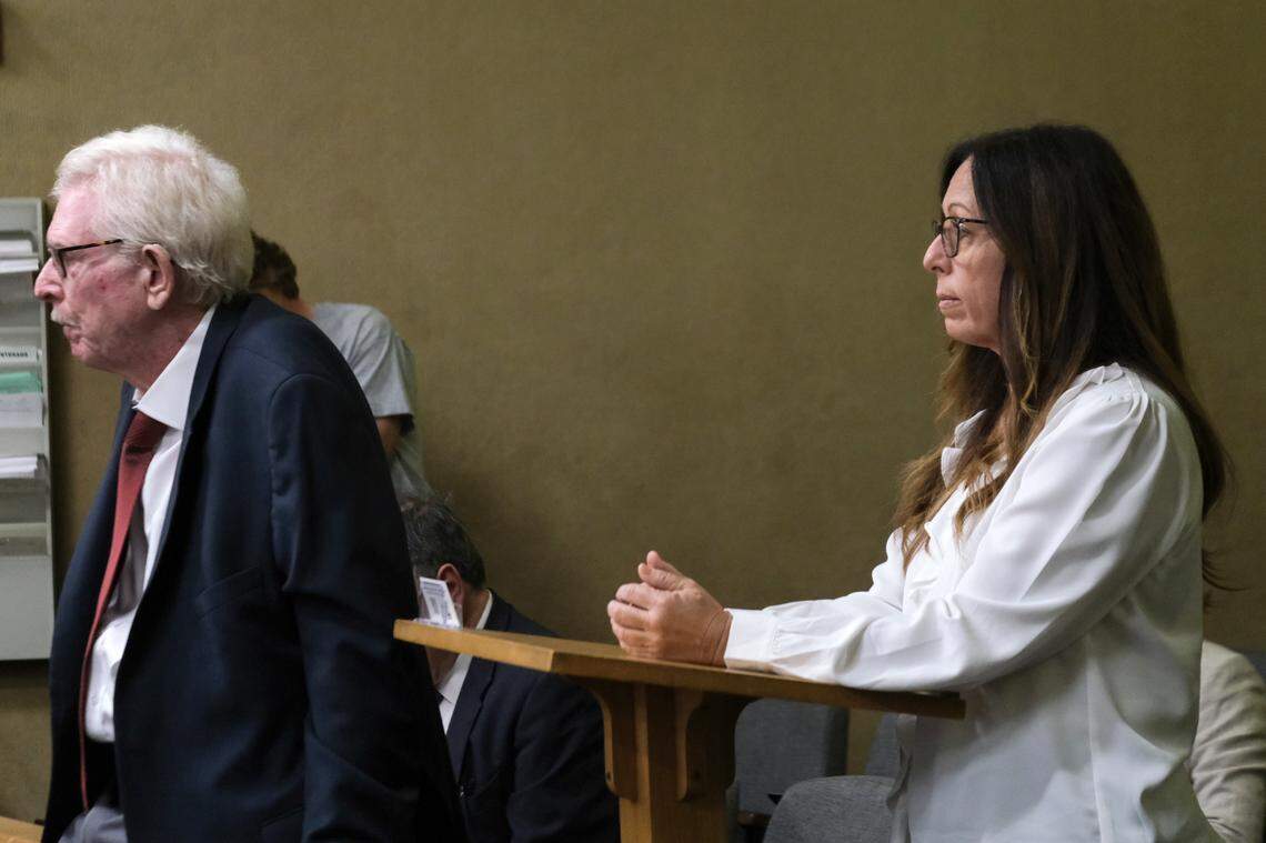 Michelle Morrow, right, attends a court hearing with her attorney, Jim Murphy, in San Luis Obispo Superior Court on Oct. 10, 2024. She was charged with a voter registration violation, voter fraud, perjury by declaration and false filing of candidacy — all felonies.