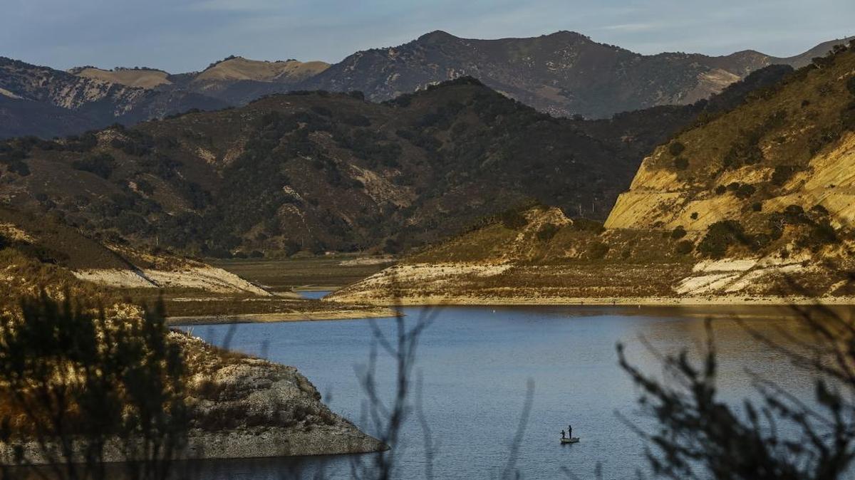 A pair of fisherman cast their lines into the waters of Lopez Lake.