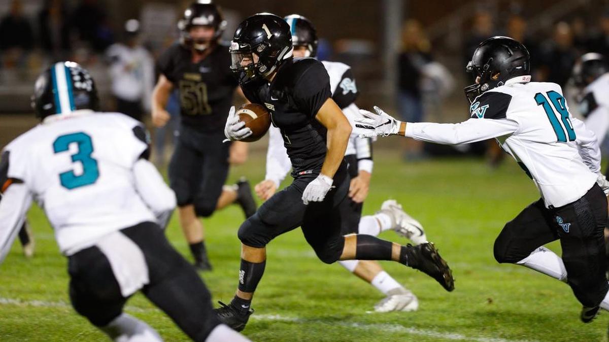 San Luis Obispo High School receiver/running back Jeremy Fitzsimmons runs for a first-half touchdown Friday night against Pioneer Valley.
