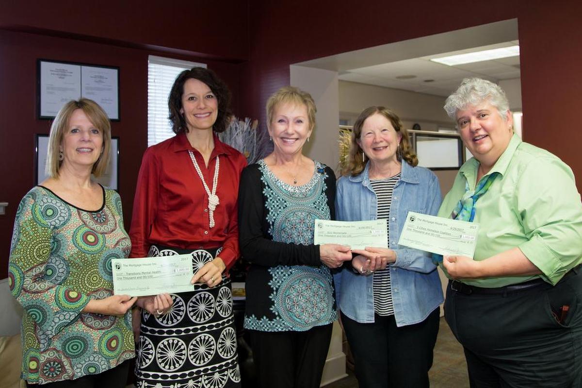 Three local nonprofits each received a $1,000 donation from The Mortgage House. From left are Mary Trudeau, VP/sales manager, Jill Bolster-White, executive director, and Roxanne Carr, division president, all of Transitions-Mental Health Association; Sandy Richardson, president, SLO Womenade; Janna Nichols, executive director, 5Cities Homeless Coalition.