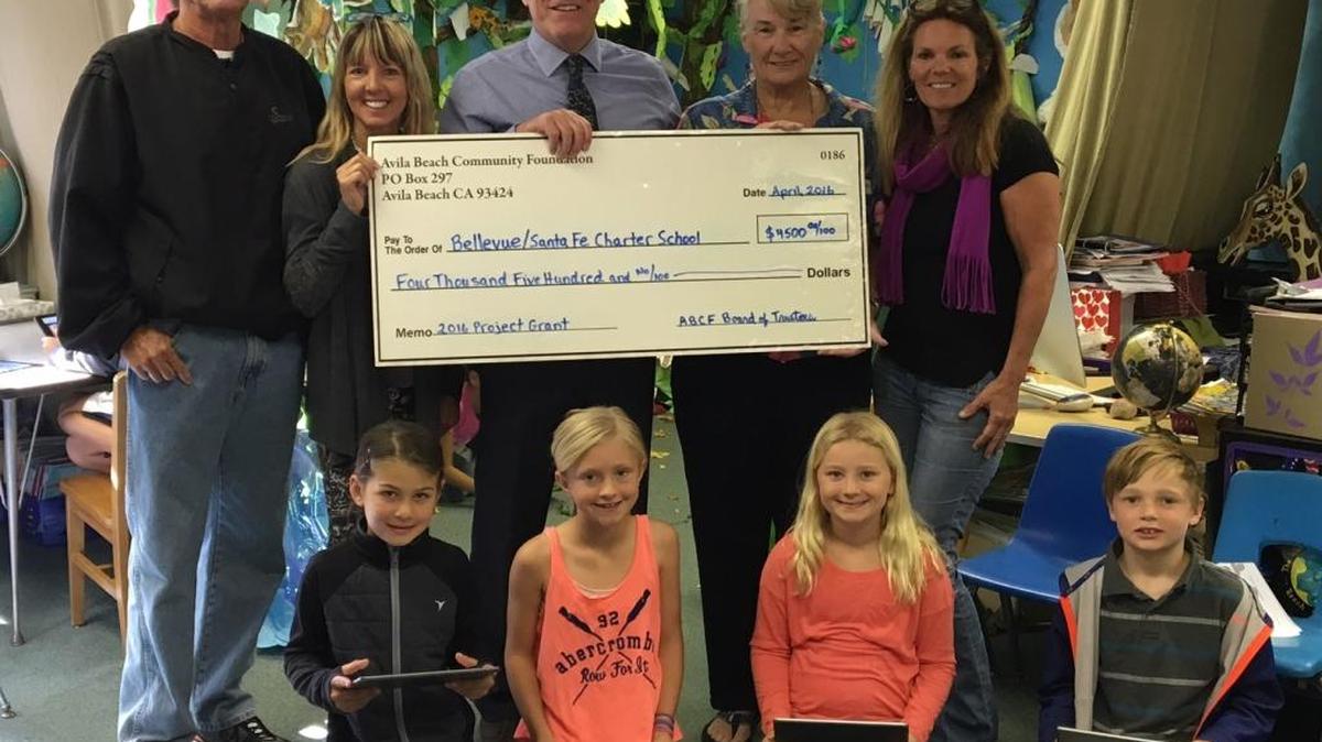 The Avila Beach Community Foundation donated $4,500 to the Bellevue-Santa Fe Charter School. Principal Brian Getz, center, holds the ceremonial check presented by foundation Executive Director Rick Cohen, left, Beverly Aho and Lucinda Borchard, foundation board members, and teacher Betsy Schaffer. Students sitting from left are Kaila Ashby, Scarlett Salter, Kynsi Szytel and Evan Ellman.