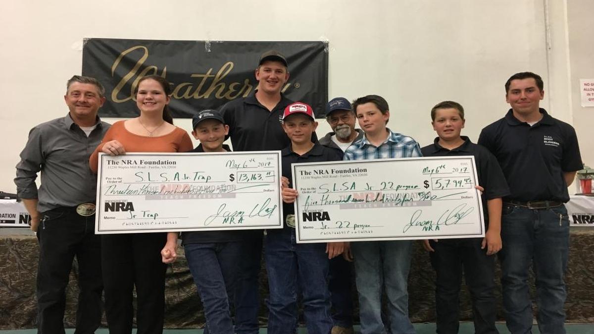 At a recent fundraiser hosted by Friends of the NRA, two checks were presented to the Santa Lucia Sportsmen’s Association for youth programs. From left are Jason Quick, Riley Shiel, Wyatt Quick, Wyatt Hambly, Tyler Cassara, Ed Merritt, Carter Andres, Chase Christensen and Garrett Shiffer. Not pictured is Keith Baker, program coordinator and coach.