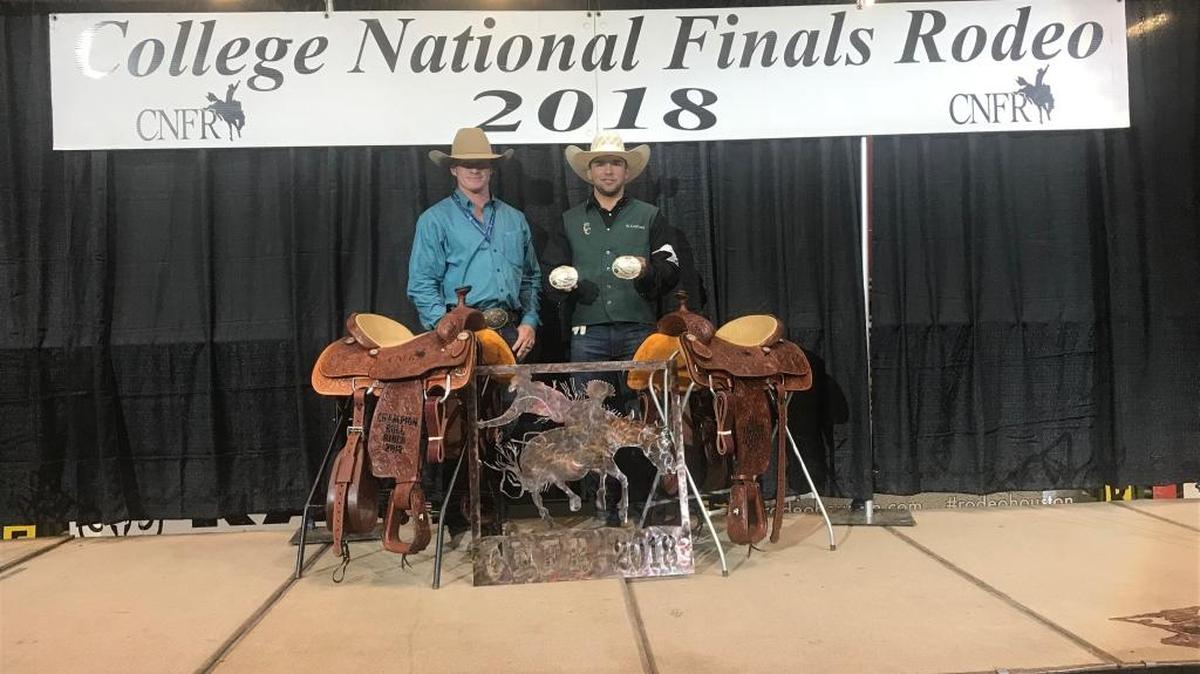 Cuesta College Rodeo Team Coach Clint Pearce (left) stands with Cuesta College Rodeo Team Student Athlete Will Centoni at the 2018 College National Finals Rodeo in Casper, Wyoming