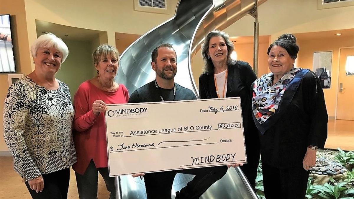 Members of Assistance League of San Luis Obispo County accept a check in the amount of $2,000 from Mindbody. From left are Bonnie Long, grant writer; Sue Pino, Assistance League president; Rick Stollmeyer, Mindbody CEO; Charlene Ables, chair of the Assistance League grants committee; and Francie Levy, Assistance League VP resource development.