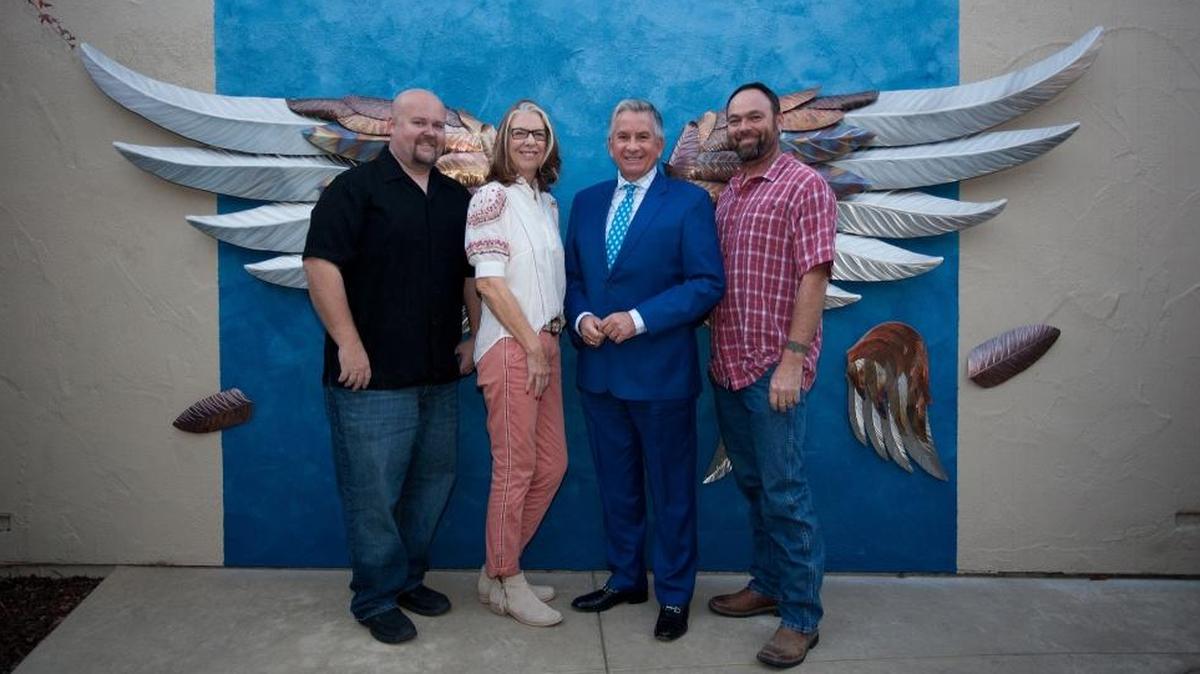 From left, Eric Malicoat, Jackie Starr, Alan Iftiniuk and Sean Beauchamp dedicate the newly installed art piece titled “Wings of Grace” in the main breezeway entrance of French Hospital.