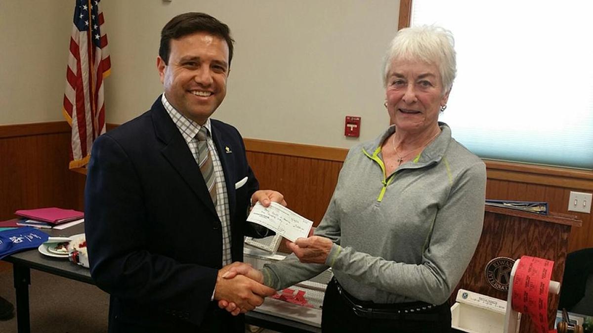 The Kiwanis Club of Paso Robles made a $250 donation to the Boy Scouts of America Los Padres Council. Accepting the check from Kiwanis President June Schneider is Scout Executive/CEO Carlos Cortez of the Los Padres Council.