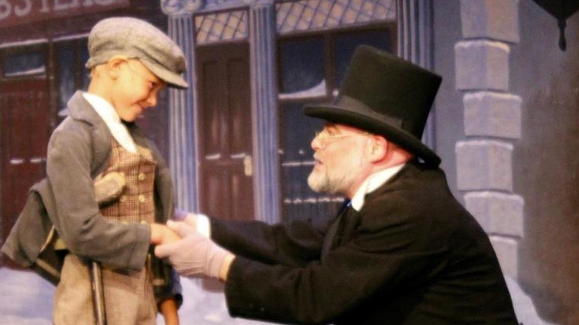 Tiny Tim (Bennet Witlieb) and Ebenezer Scrooge (Beau Hickman) appear in a scene from "A Christmas Carol," part of "The Holiday Extravaganza." The show runs Thursday through Dec. 31 at the Great American Melodrama and Vaudeville in Oceano.