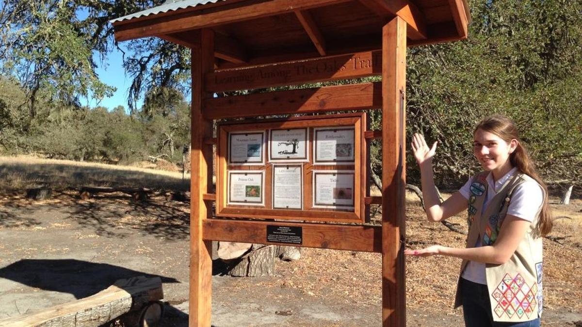 Alexis Whiteford created and installed an informational kiosk at the beginning of a nature trail to earn her Girl Scout Gold Award.