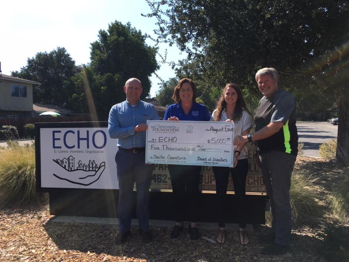 From left, Len Smolburd, grants manager with The Community Foundation, presents a check in the amount of $5,000 to Wendy Lewis, president/CEO of ECHO Homeless Shelter, Mimi Rodriguez, chaperone coordinator at ECHO, and Eric Gobler, board chair of ECHO, in 2018.
