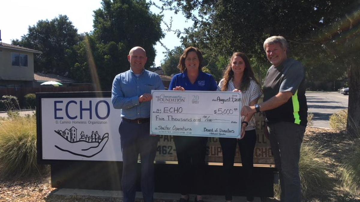 From left, Len Smolburd, grants manager with The Community Foundation, presents a check in the amount of $5,000 to Wendy Lewis, president/CEO of ECHO Homeless Shelter, Mimi Rodriguez, chaperone coordinator at ECHO, and Eric Gobler, board chair of ECHO, in 2018.