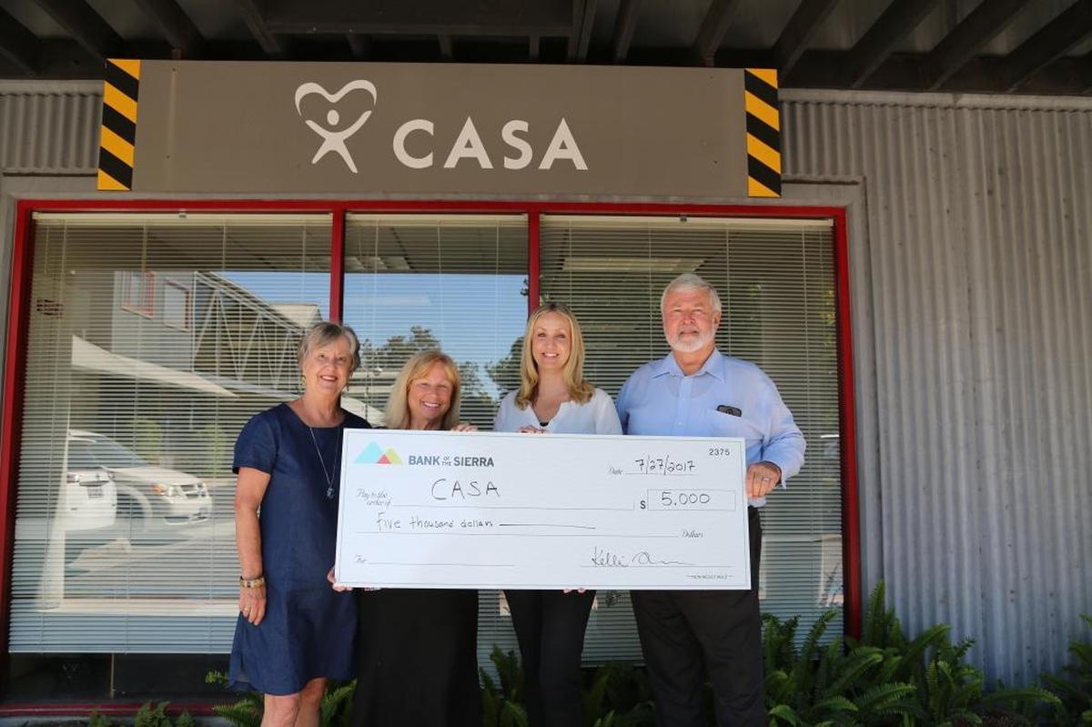 From left, Susan Graves, CASA grants and development coordinator; Teresa Tardiff, CASA executive director; Kelli Blackburn, Bank of the Sierra market president; and Charlie Fruit, Bank of the Sierra VP commercial loan officer celebrate the bank’s recent donation.
