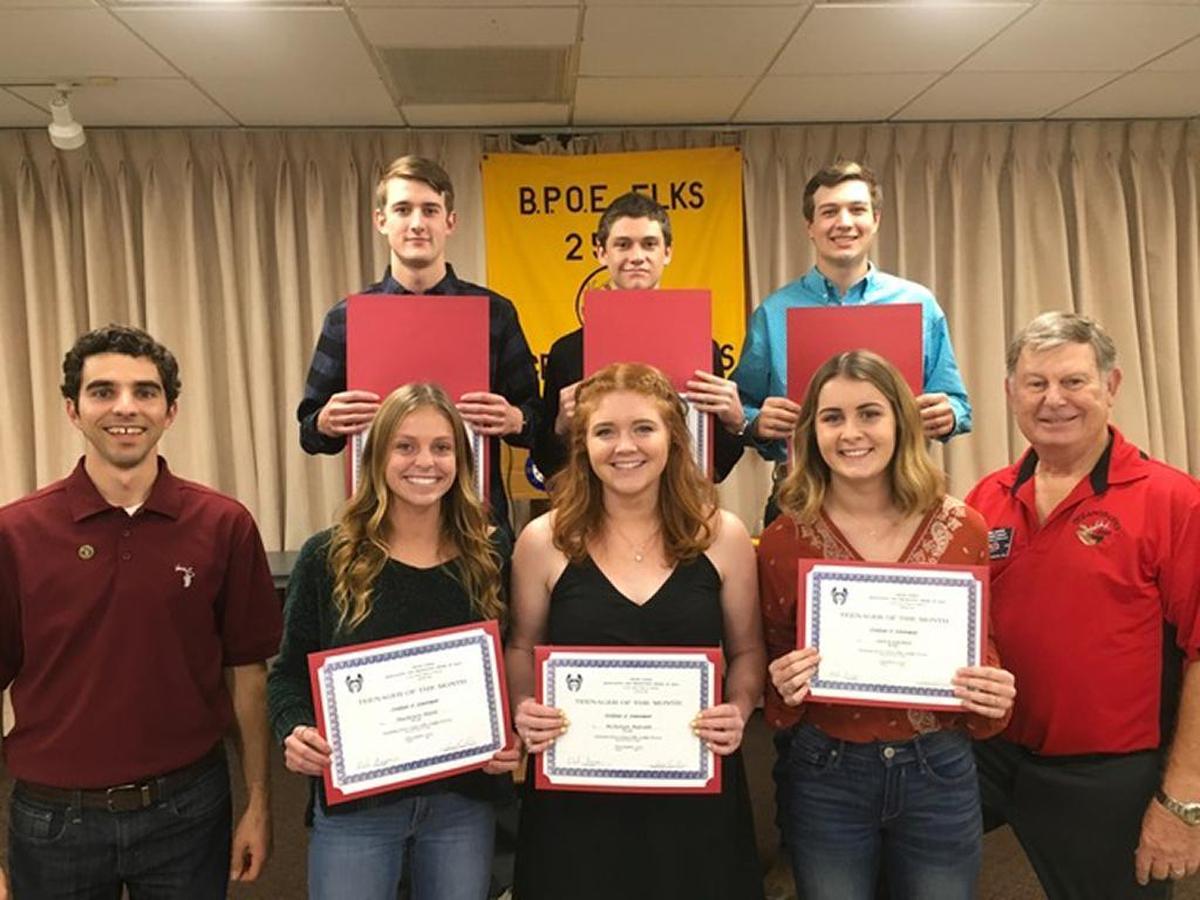 Nipomo High School Teenagers of the Month accept their awards from Oceano/Five Cities Elks Lodge No. 2504 Scholarship Chair Sean Pringle, left, and Leading Knight Mel Baker, right.