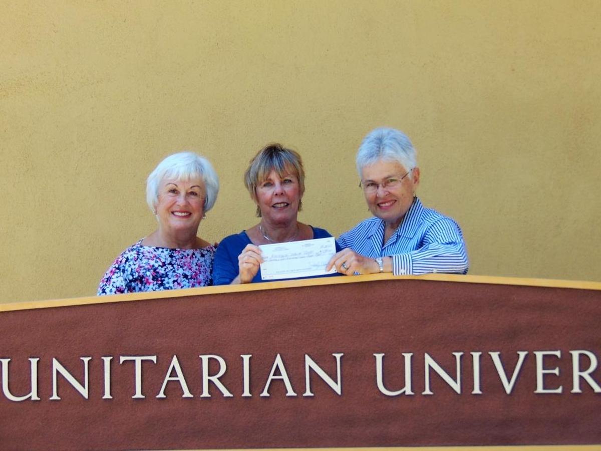 From left, Bonnie Long, grants committee member with Unitarian Universalist Fellowship, Sue Pino, Assistance League president, and Judy Hornaday, UU Fellowship community outreach program coordinator, celebrate the donation.