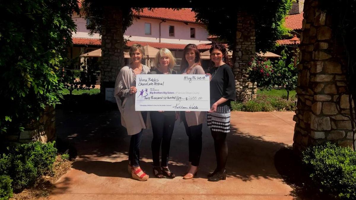 The Chocolate Festival at Vina Robles raised $2,650 for Big Brothers Big Sisters of San Luis Obispo County. From left, Patty Carpenter and Karen Colombo of Big Brothers Big Sisters accept a check from Kathleen Wells and Gerrie Adams of Vina Robles.
