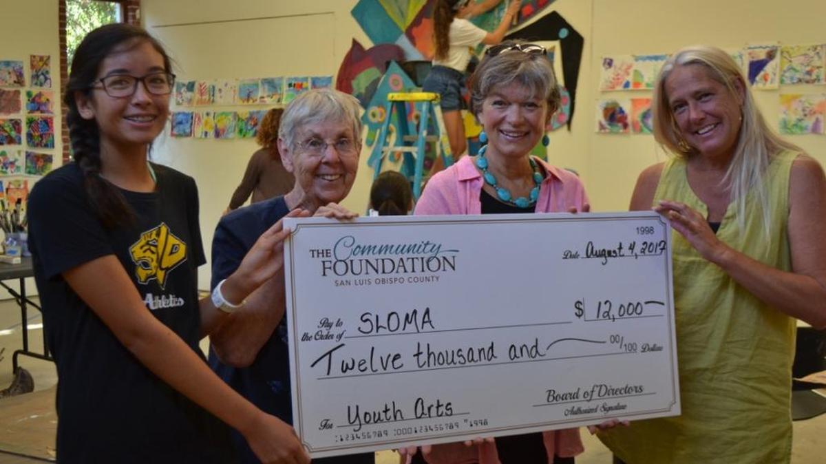 The Community Foundation San Luis Obispo County presents SLO Museum of Art’s youth education staff with a check for $12,000. Shown from left are Olivia Dong, student aide; Beth Mott, youth education coordinator; Heidi McPherson, Community Foundation executive director; and Wendy R. Walter, registrar.