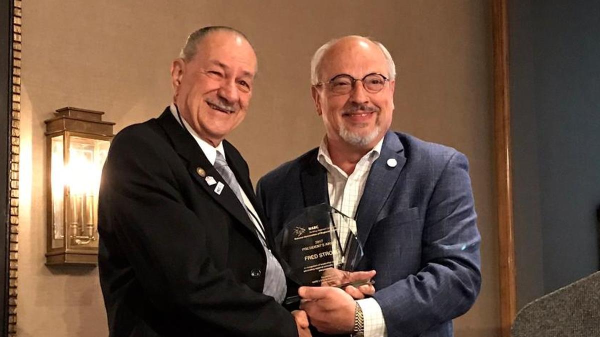 Paso Robles City Councilman Fred Strong, left, accepts his appointment to serve on the National League of Cities’ Transportation and Infrastructure Services Committee.