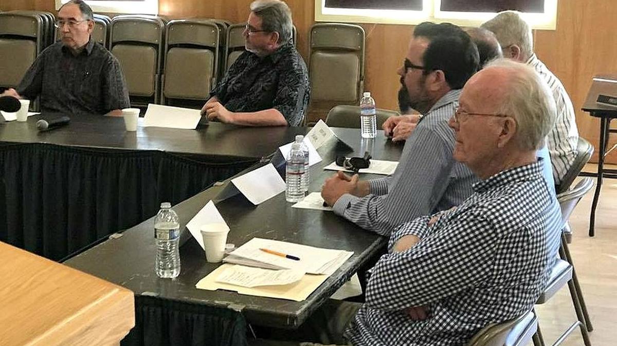 The board whittled the field of 12 down to six finalists: Peter Chaldecott and Mark Herrier (far table); and Allan MacKinnon (near table, closest) Aaron Wharton and (obscured) Bruce Fosdike and Dewayne Lee.