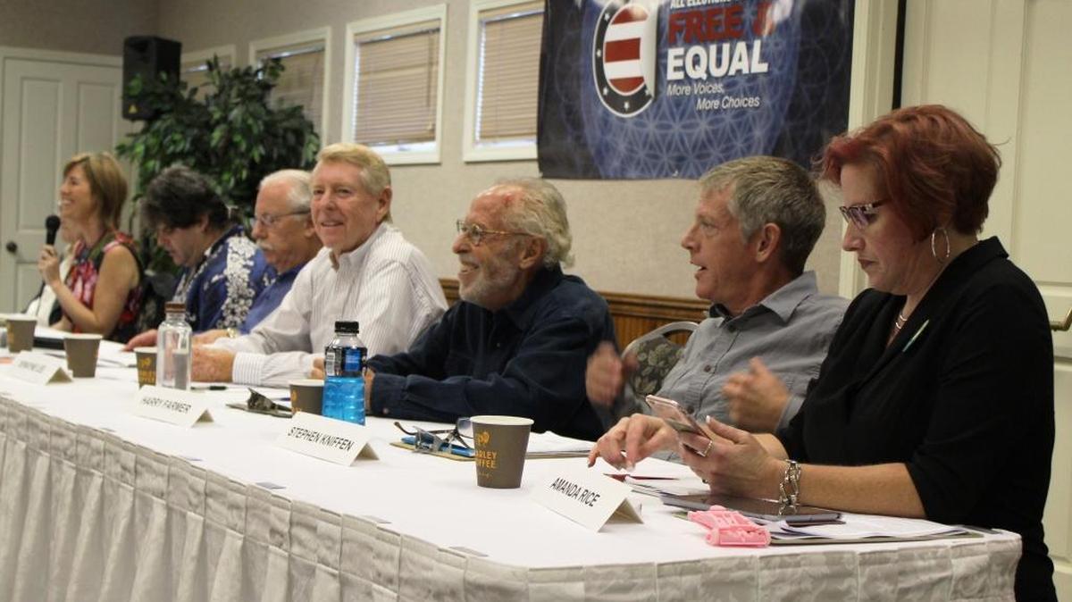 The panel opens Thursday night’s forum. From left: co-moderators Ed Asner (obscured) and Christina Tobin; candidates Jeff Walters, Tom Kirkey, Dewayne Lee, Harry Farmer, Stephen Kniffen and Amanda Rice.
