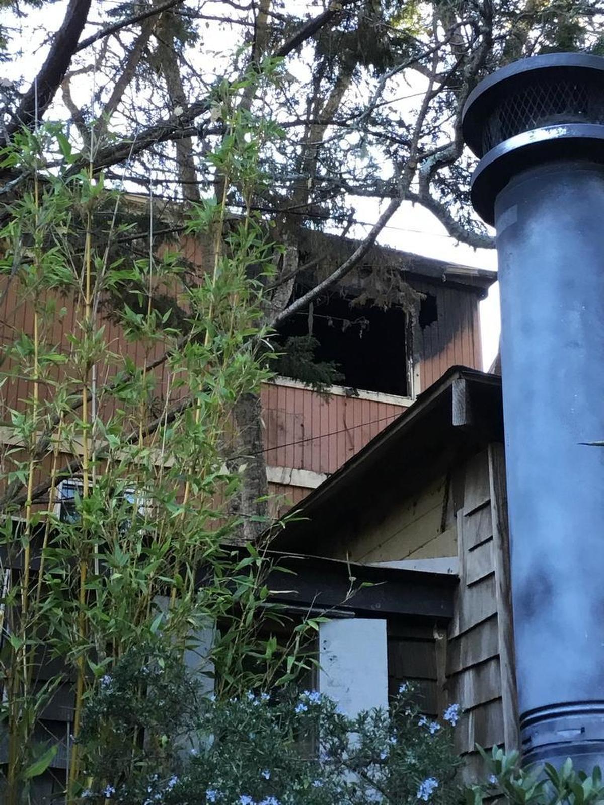 The charred window frame of the house on the 2400 block of Leona Drive after the fire.
